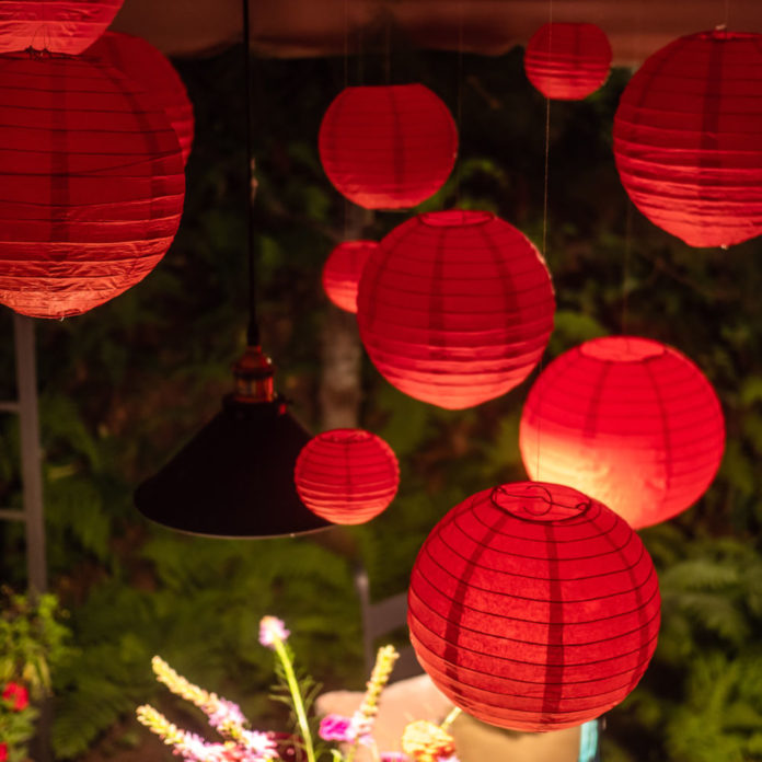 Hanging red paper lanterns and a lamp