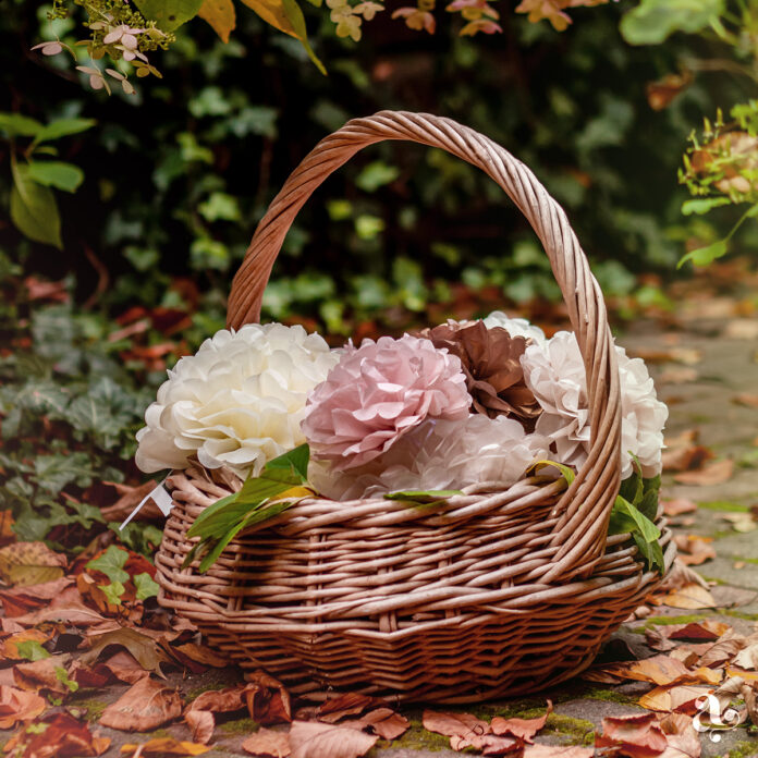 Boho paper pom poms in a basket